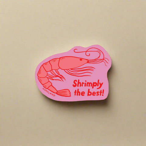 Pink sticker with a shrimp illustration and text 'Shrimply the best!' on a white background