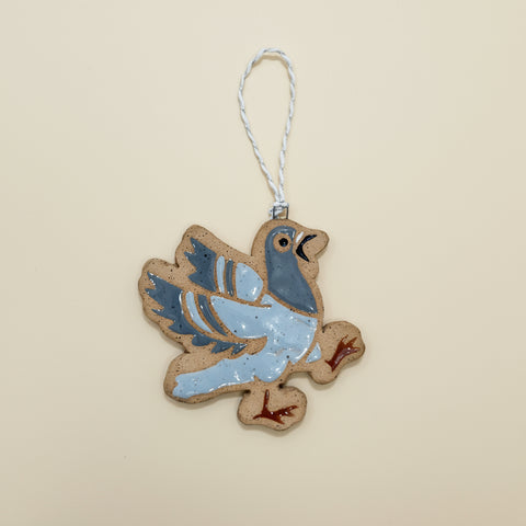 Decorative bird ornament on a wooden surface