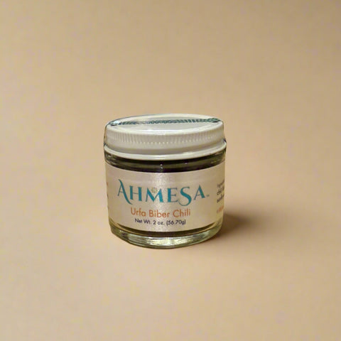 Jar of Ahmesa product on a wooden counter