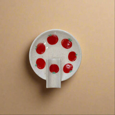 White ceramic ashtray with tomato pattern