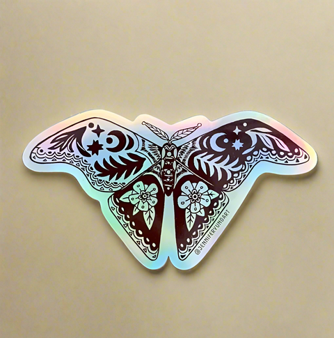 Holographic butterfly sticker on a tan surface