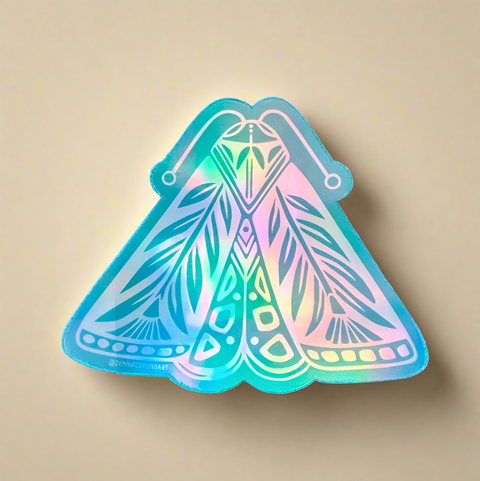 Holographic cicada sticker with geometric design on a tan surface