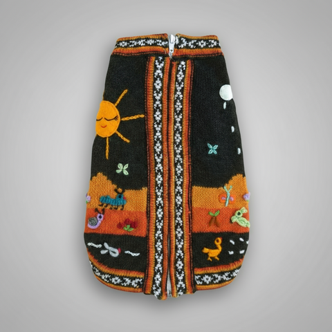 Knitted dog sweater with colorful patterns on a white background