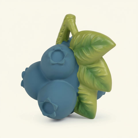 Blueberry-shaped teether with green leaves on a white background