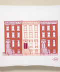tea towel with red brick building design on a white background