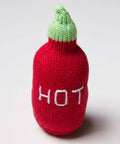 Knitted chili pepper toy with green top and 'HOT' text on a white background