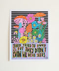 Colorful illustration of mushrooms and flowers with text on a white background, surrounded by pink tinsel.