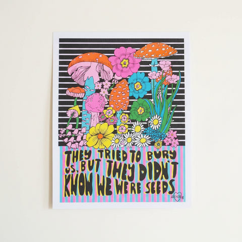 Colorful illustration of mushrooms and flowers with text on a white background, surrounded by pink tinsel.