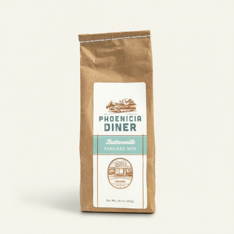 Kraft paper bag of Phoenicia Diner Buttermilk Pancake Mix on a white background