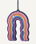 Colorful rainbow-shaped air freshener with stars on a blue background