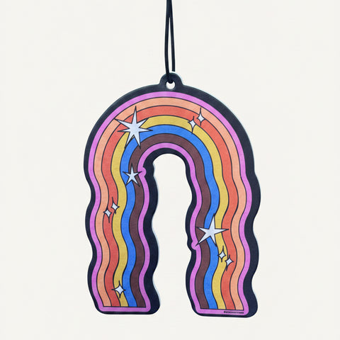 Colorful rainbow-shaped air freshener with stars on a blue background