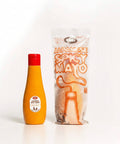 Orange bottle with red cap and clear packaging labeled 'Japanese Spicy Mato' on a white background
