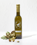 Bottle of Saratoga Olive Oil Co. olive oil with mushrooms and sage on a white background