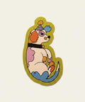 Colorful sticker of a dog with a party hat on a pink fabric background