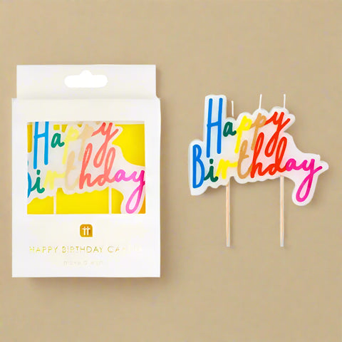 Colorful 'Happy Birthday' cake toppers with packaging on a white background