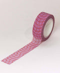 Roll of pink grid-patterned tape on a white background