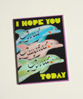 A greeting card with dolphins on it