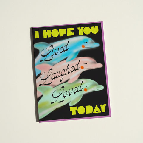 A greeting card with dolphins on it