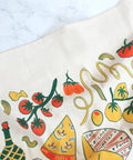 Fabric with colorful pizza, tomato, and olive pattern on a white background