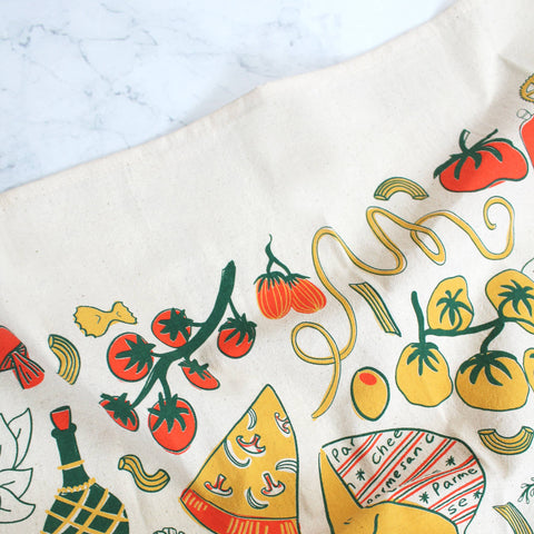 Fabric with colorful pizza, tomato, and olive pattern on a white background