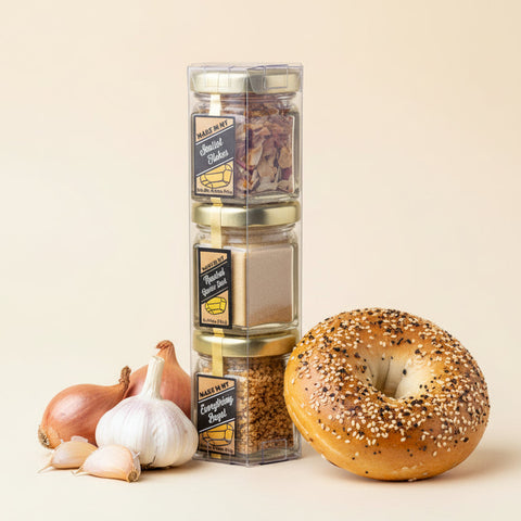 Hexagonal spice set with labeled jars on a light wooden surface