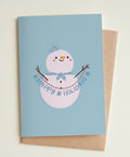 Greeting card with a snowman illustration and 'Happy Holidays' text on a light blue background.