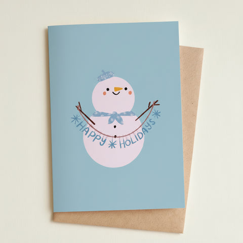 Greeting card with a snowman illustration and 'Happy Holidays' text on a light blue background.
