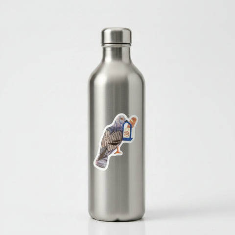 A die-cut sticker featuring a collage-style bird with newspaper print wings and a blue-and-white baguette-shaped accessory, shown on a plain light background.