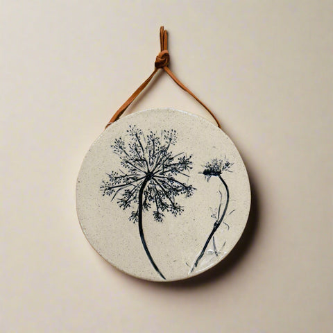 Round decorative wall hanging with queen annes lace design 