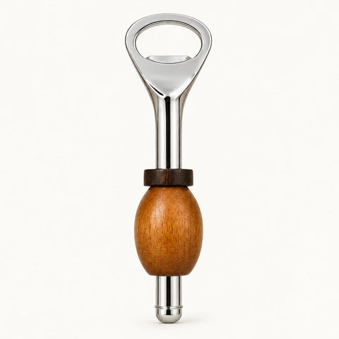 A bottle opener with a polished silver metal body and a round wooden handle, resting on a light brown wooden tabletop.