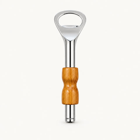 A bottle opener with a polished silver metal head and a contoured wooden handle, placed vertically on a light brown wood-grain surface.