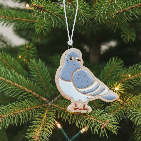 Ceramic pigeon ornament on a christmas tree