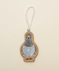 Pigeon-shaped ornament on a wooden surface