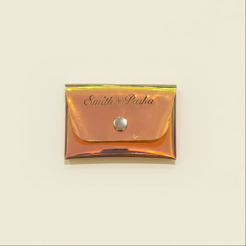 Rose gold pouch with 'Smith & Parka' branding