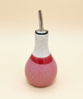 Pink and white ceramic oil cruet