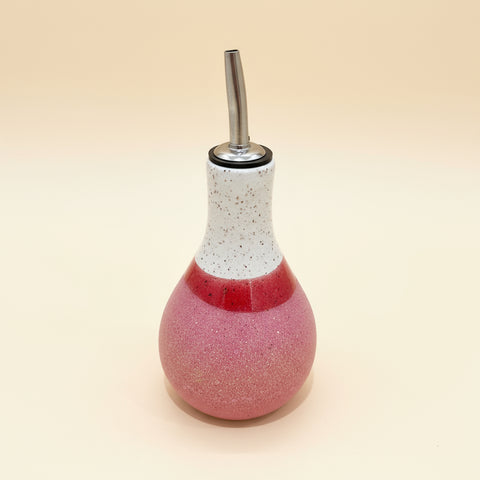 Pink and white ceramic oil cruet