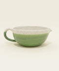 Green and white ceramic salad dressing bowl