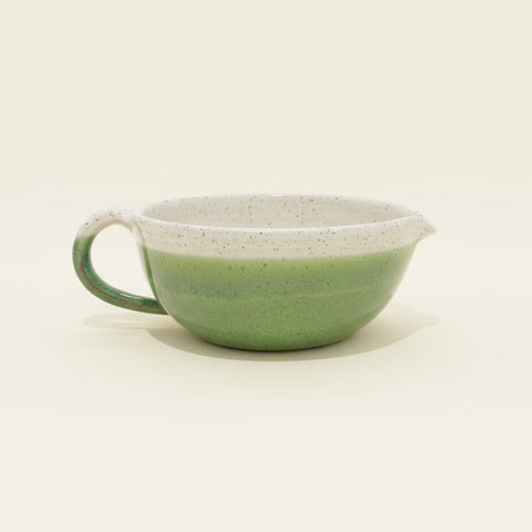 Green and white ceramic salad dressing bowl