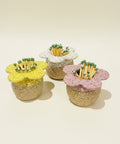 Three flower-shaped ceramic matchboxes with matches