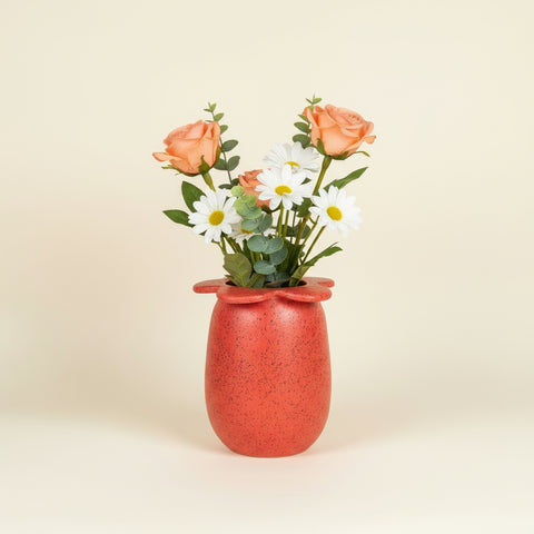 Red ceramic vase with flowers