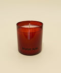 Red candle with 'BOUGIE FUNK' branding on a wooden surface