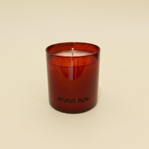 Red candle with 'BOUGIE FUNK' branding on a wooden surface