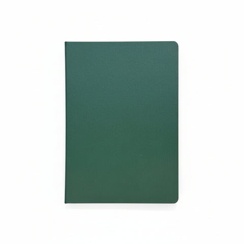 Green notebook on a wooden surface
