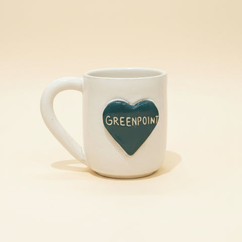 White mug with a dark green heart with 'Greenpoint' text written across it.