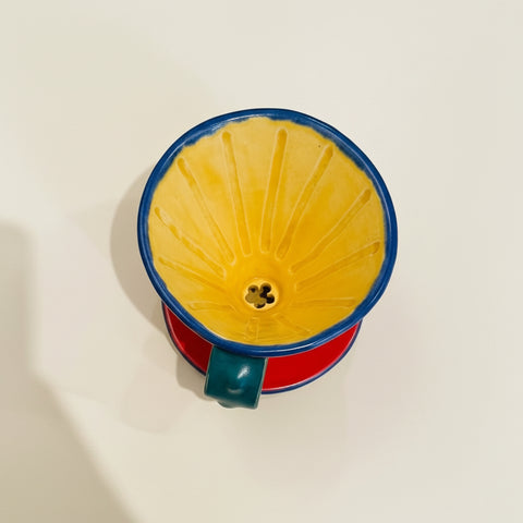 ceramic pour-over mug on a cream colored background