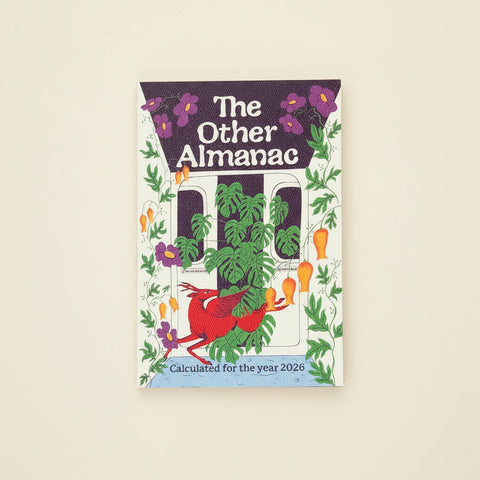 Book titled 'The Other Almanac' on a wooden surface