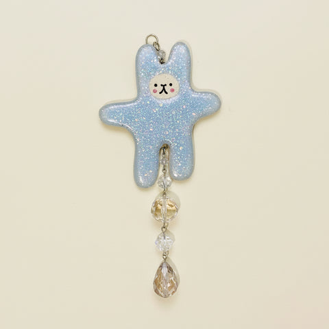 Decorative sun catcher with a star-shaped design on a wooden surface