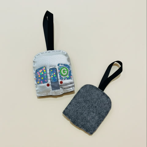 Two train shaped ornaments