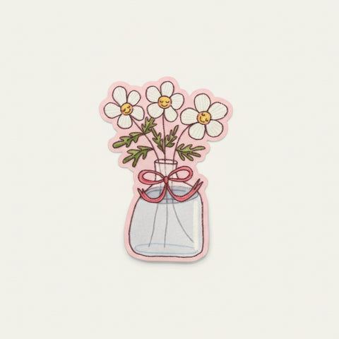 Sticker of flowers in a jar on a wooden surface