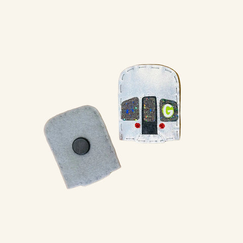 Two small electronic devices on a wooden surface